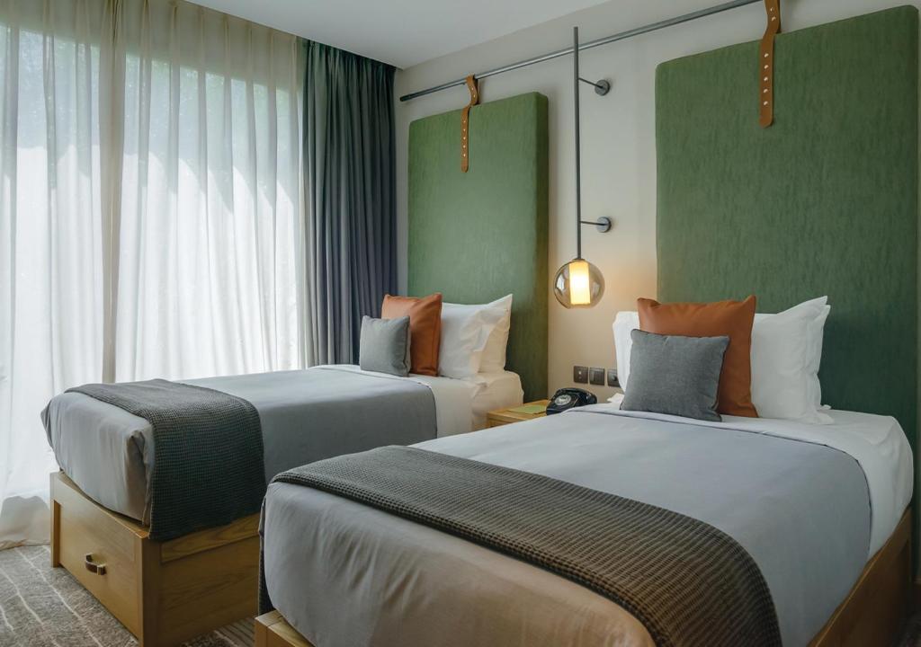 Postel nebo postele na pokoji v ubytování The Social House Nairobi, a Preferred Lifestyle Hotel