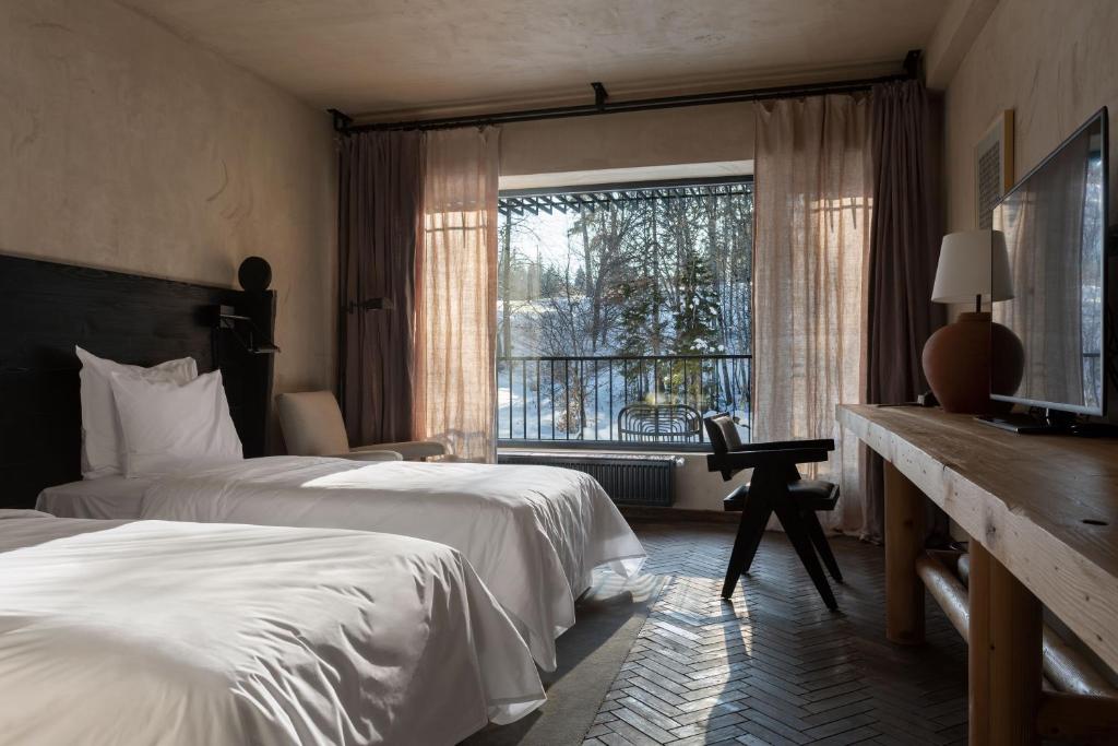 Кровать или кровати в номере Rooms Hotel Kokhta