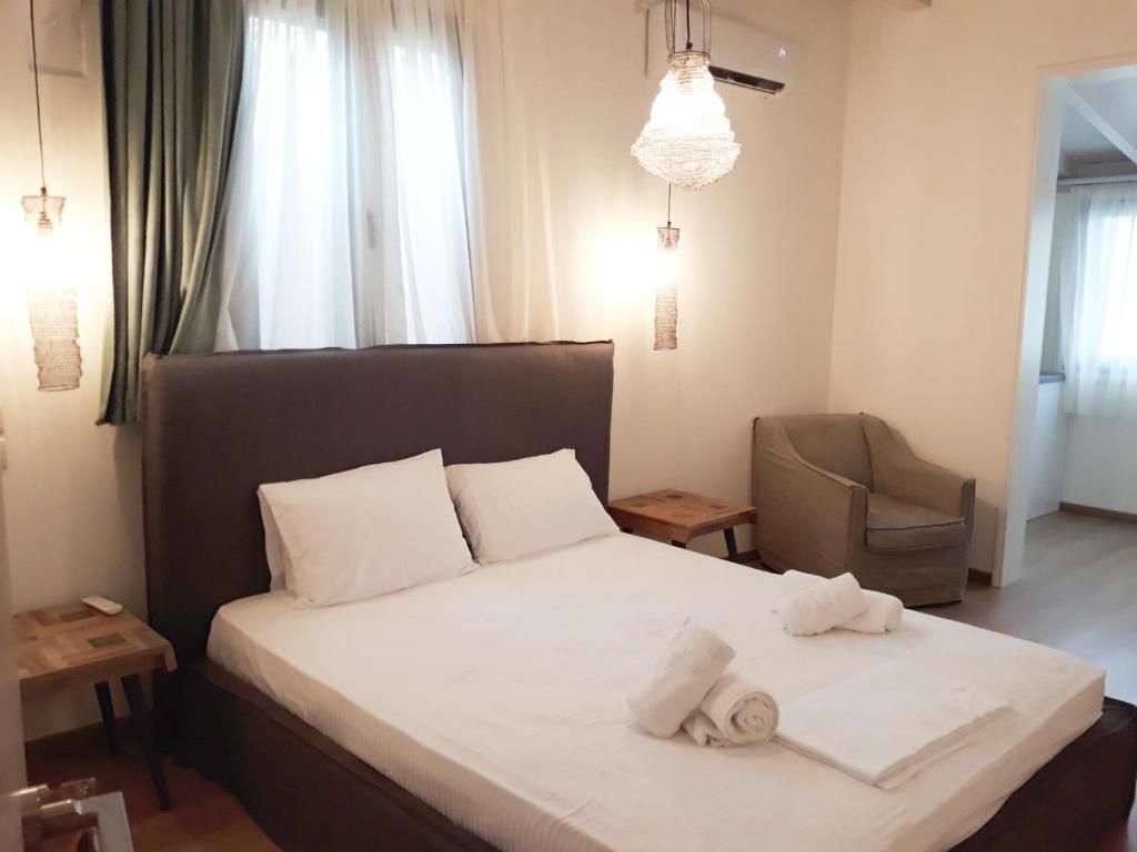 Ένα ή περισσότερα κρεβάτια σε δωμάτιο στο Lefkada Princess Junior Suite