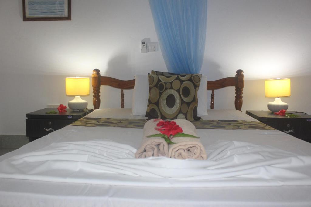 Postel nebo postele na pokoji v ubytování Zerof Guest House