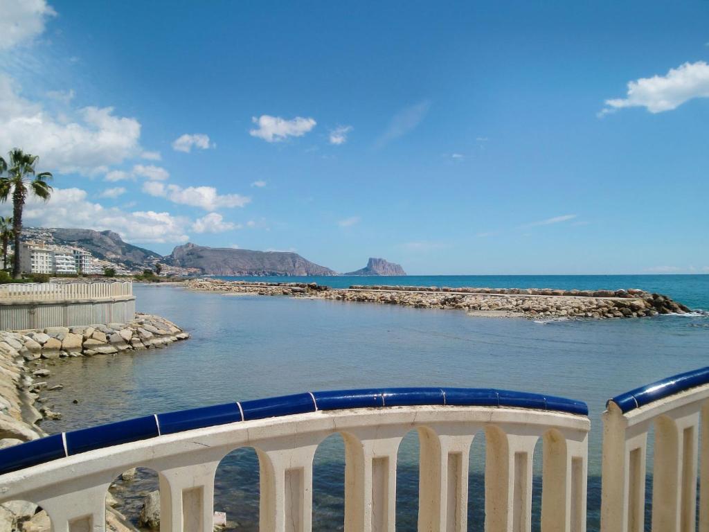 a bridge over a body of water with a beach at Apartment Bella by Interhome in Altea