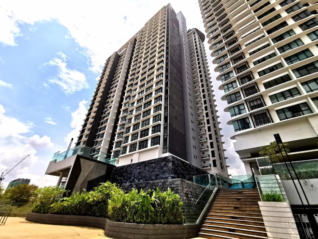 a tall building with a staircase in front of it at Mid Valley Southkey Mosaic Cozy Suite at Johor Bahru in Johor Bahru
