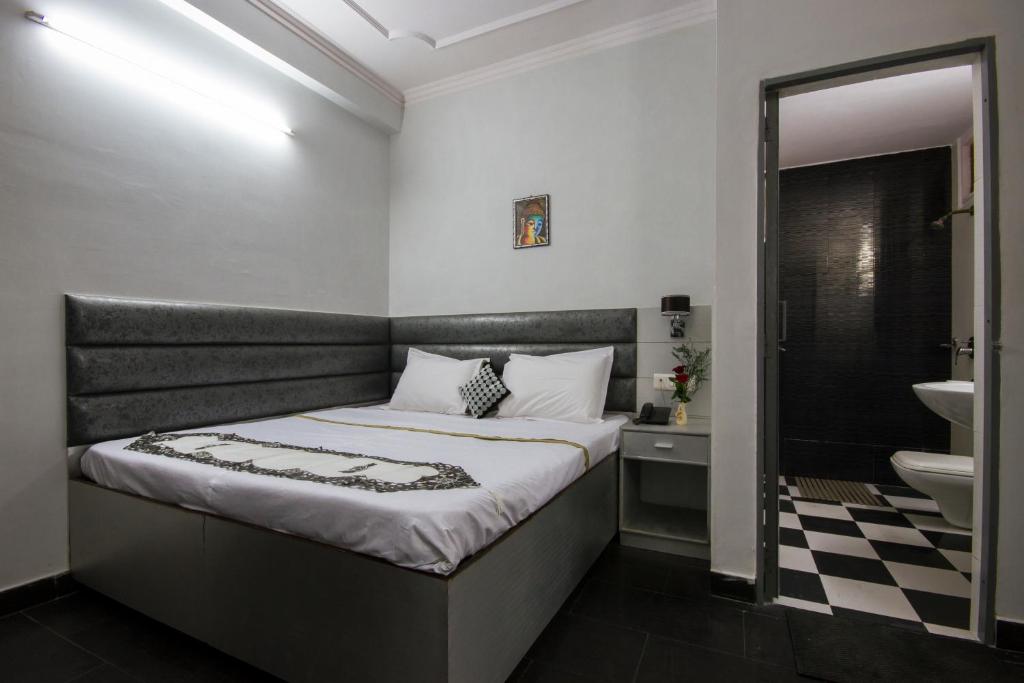Postel nebo postele na pokoji v ubytování Hotel Kwality