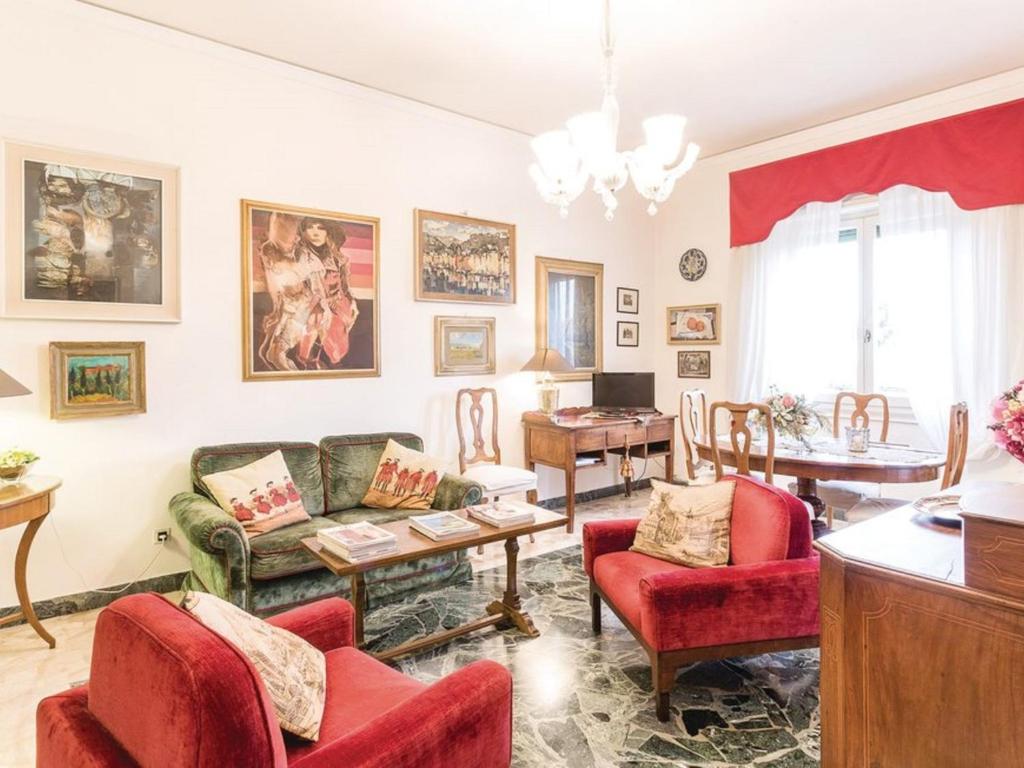 a living room with a couch and chairs and a table at Apartment La Torretta by Interhome in Florence