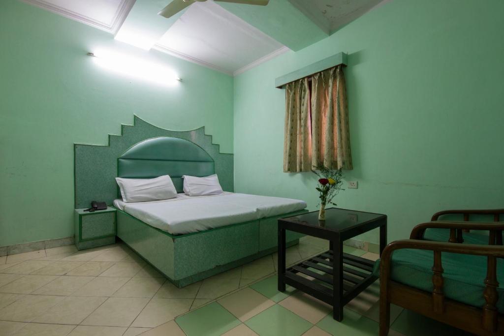 Postel nebo postele na pokoji v ubytování Hotel Kwality
