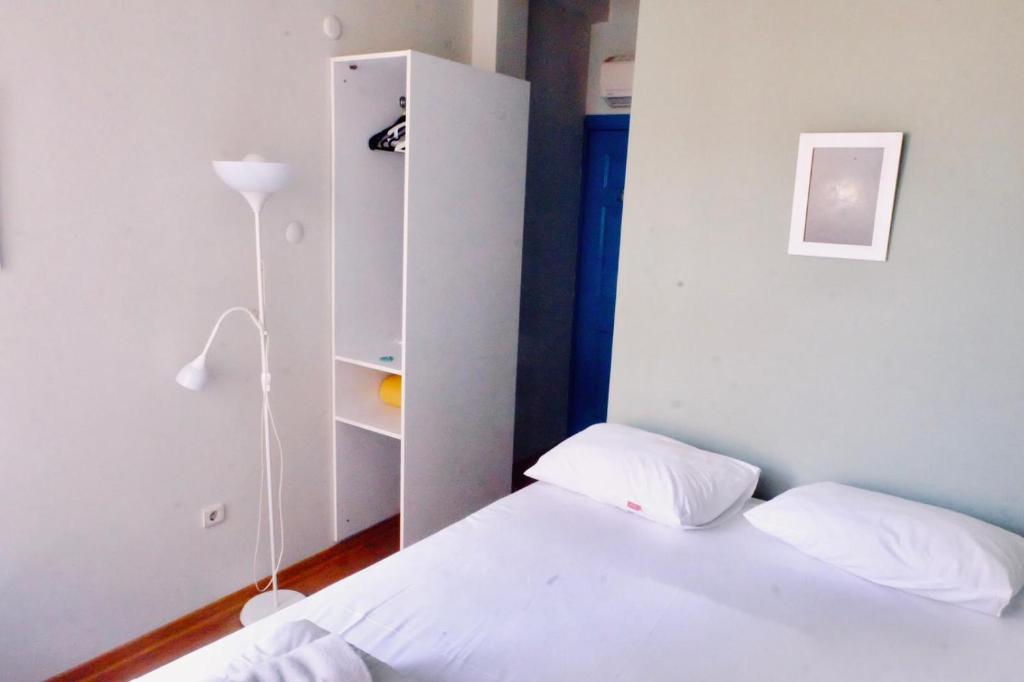 A bed or beds in a room at World House Hostel