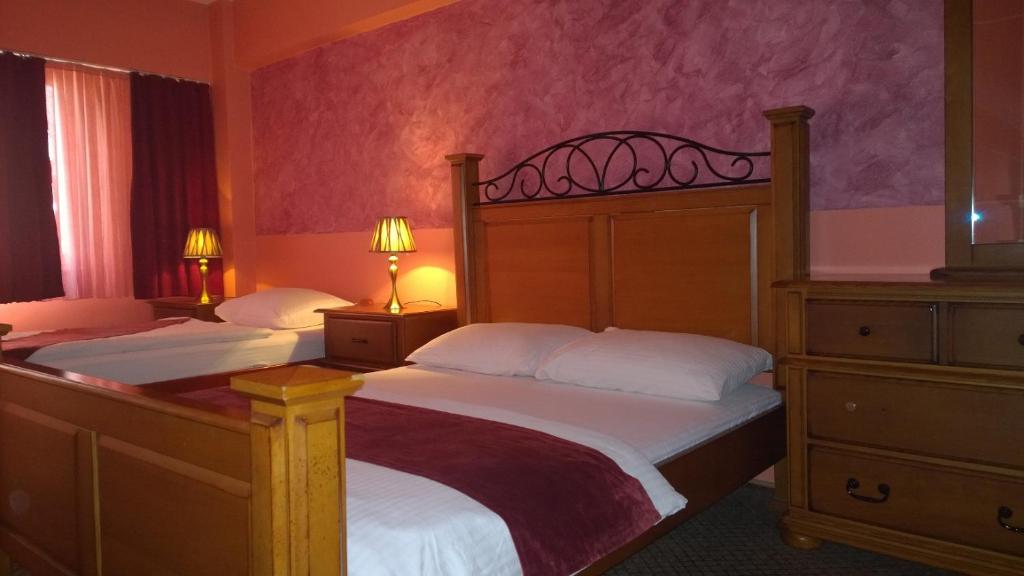 Postel nebo postele na pokoji v ubytování Hotel BM International