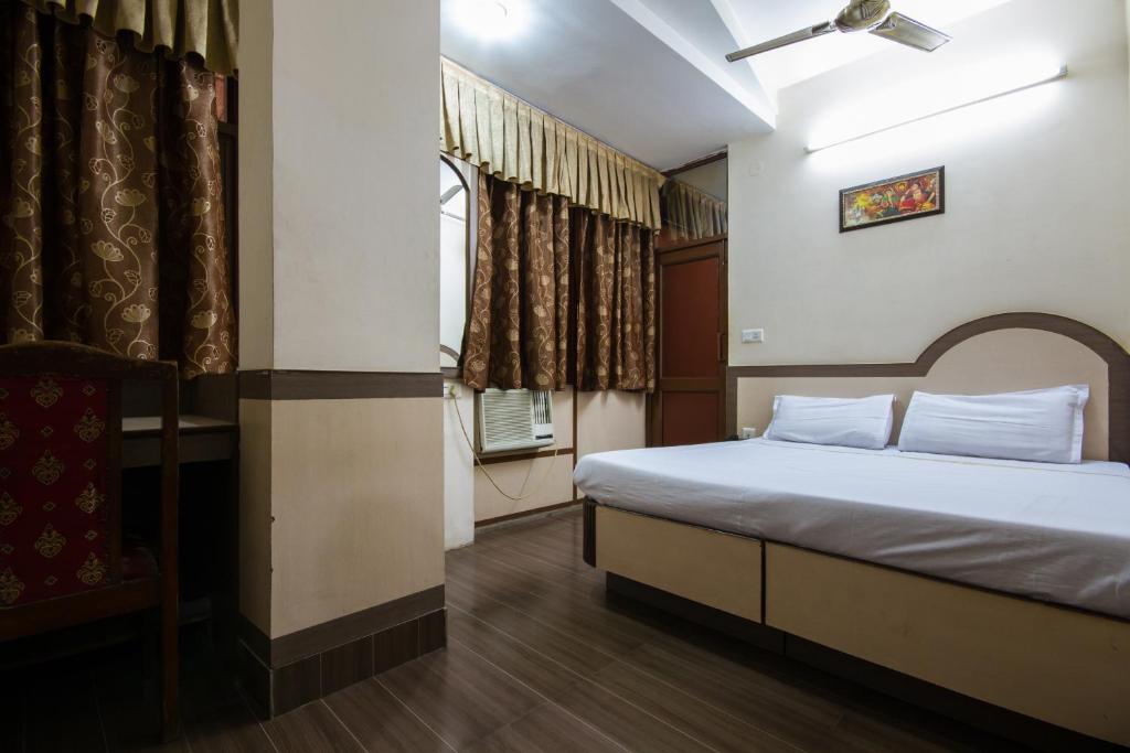 Postel nebo postele na pokoji v ubytování Hotel Kwality