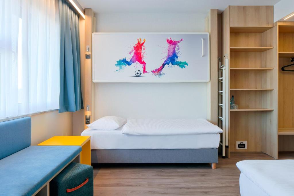 Posteľ alebo postele v izbe v ubytovaní o3Hotel