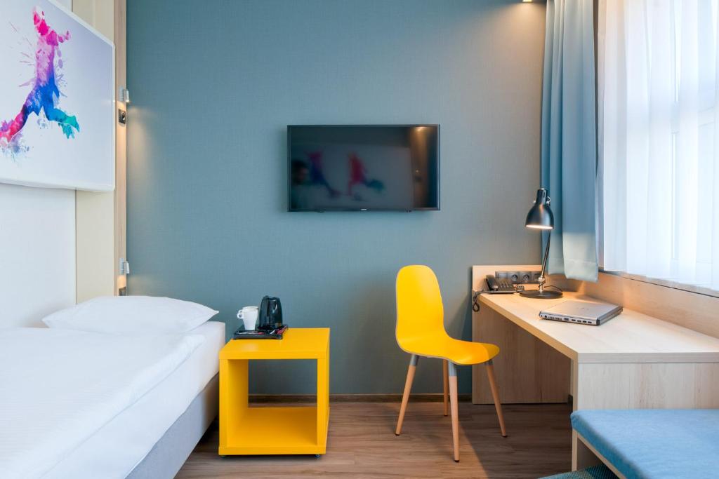 Posteľ alebo postele v izbe v ubytovaní o3Hotel