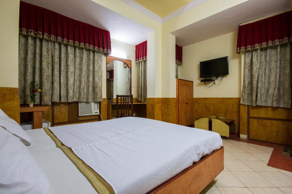 Postel nebo postele na pokoji v ubytování Hotel Kwality