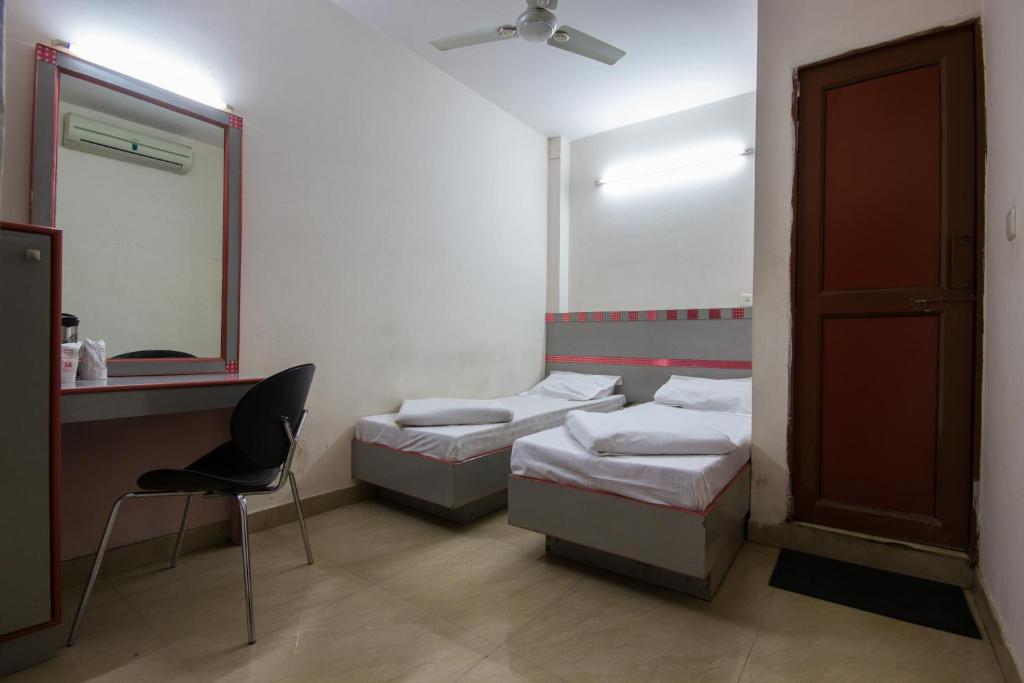 Postel nebo postele na pokoji v ubytování Hotel Kwality