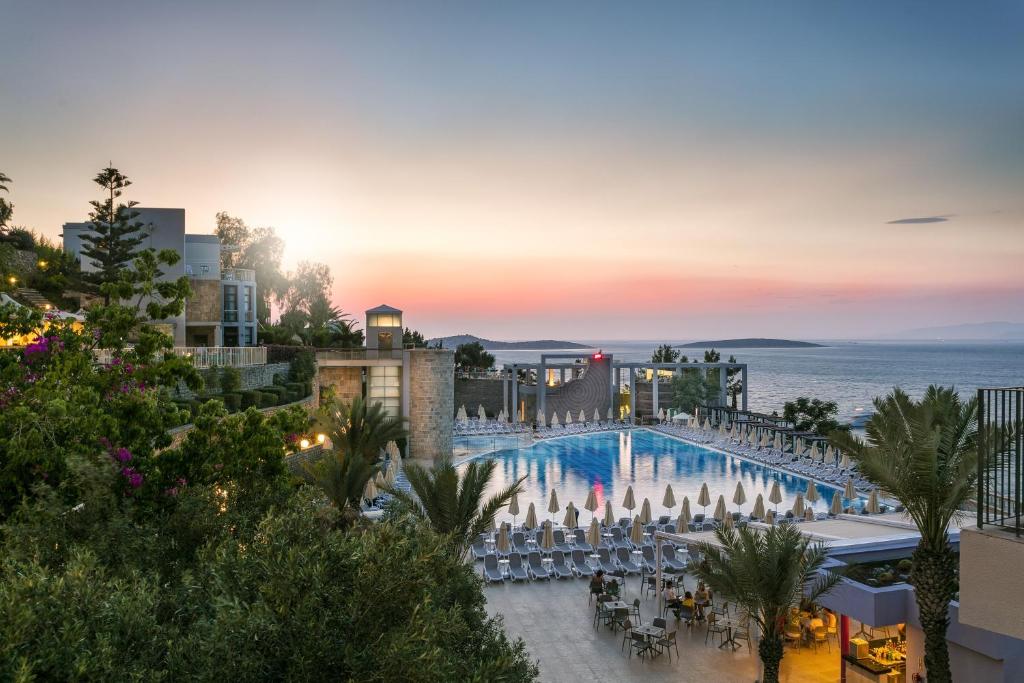 a view of a resort with a large swimming pool at Duja Bodrum in Torba