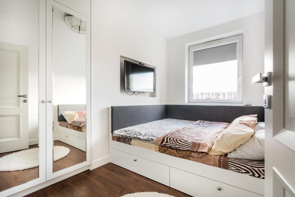 Posteľ alebo postele v izbe v ubytovaní ResiNest Apartamenty Nowe Bojary