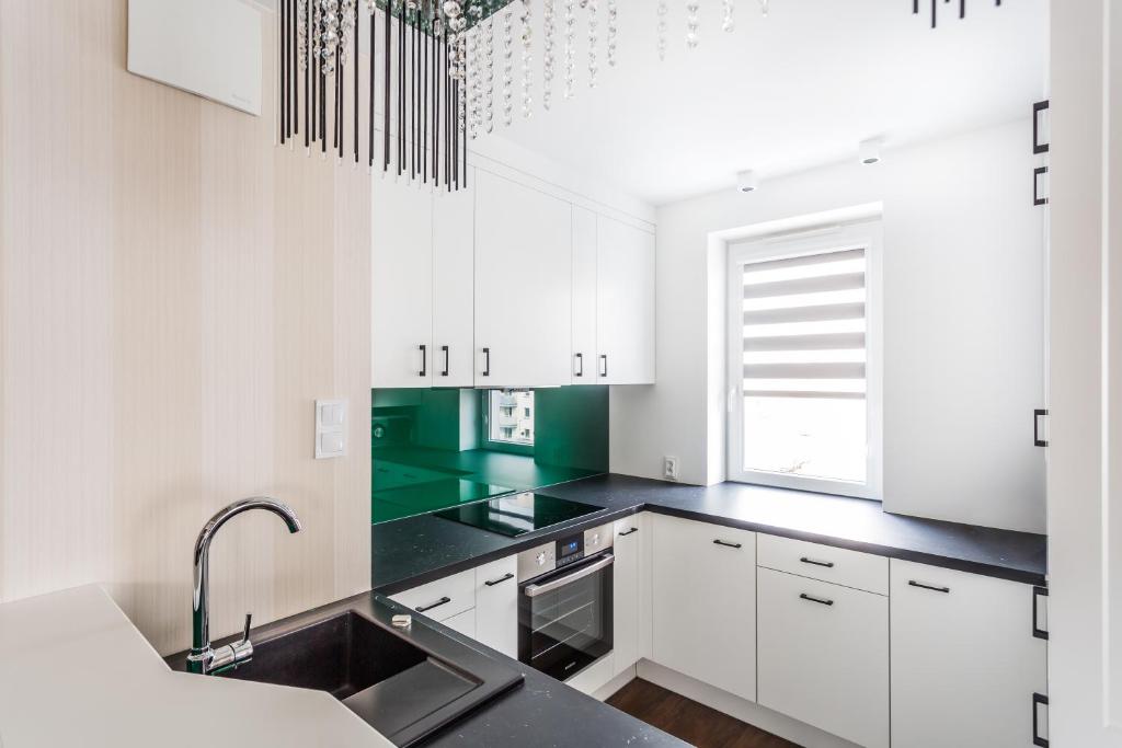 Kuchyňa alebo kuchynka v ubytovaní ResiNest Apartamenty Nowe Bojary