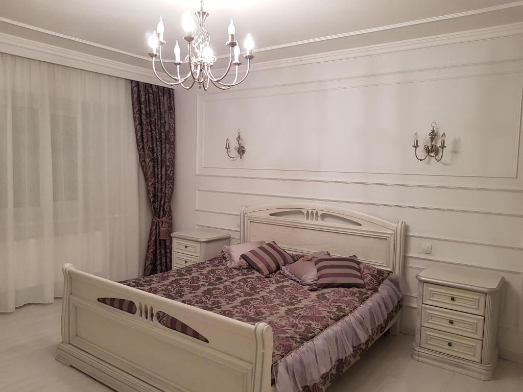 Ein Bett oder Betten in einem Zimmer der Unterkunft Оптималь