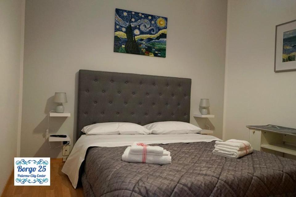 Postel nebo postele na pokoji v ubytování BORGO 25 - Palermo City Center