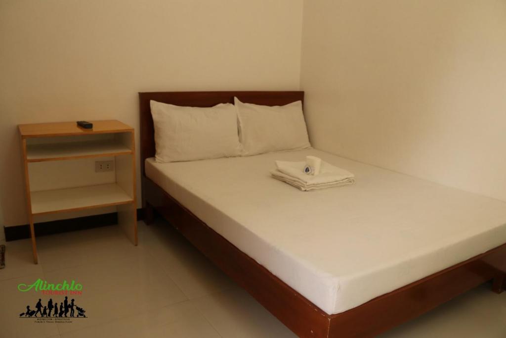 Postel nebo postele na pokoji v ubytování Alinchlo Hotel