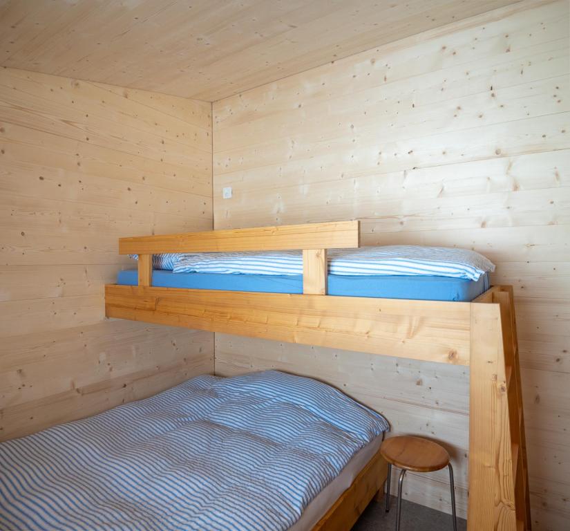 Postel nebo postele na pokoji v ubytování Labbrunnu OG in den Walliser Alpen