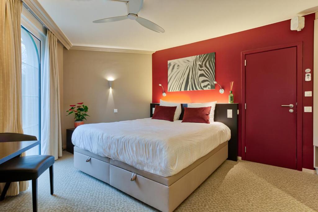 Cama o camas de una habitación en Hotel Astoria Gent