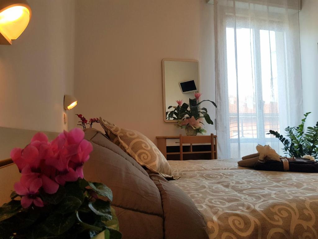 Postel nebo postele na pokoji v ubytování HOTEL ROMANTICA