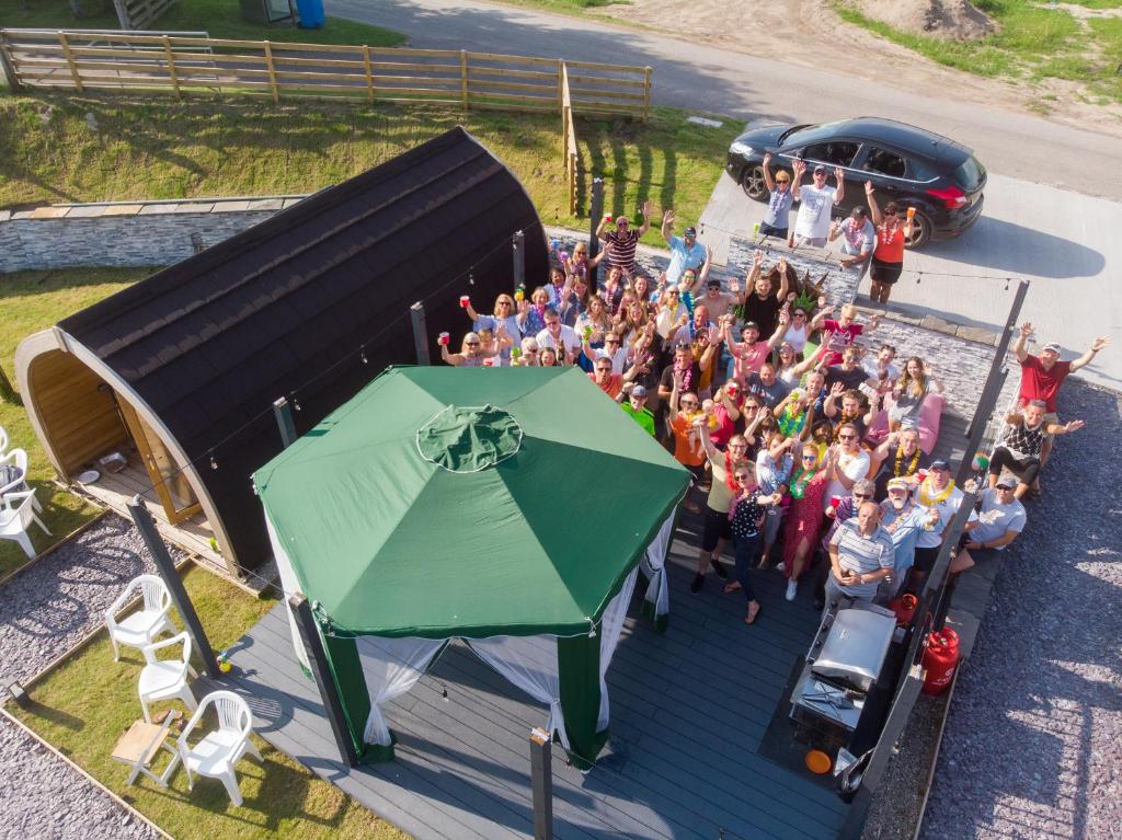 an overhead view of a group of people posing for a picture at North Coast 500 Pods in Achmelvich