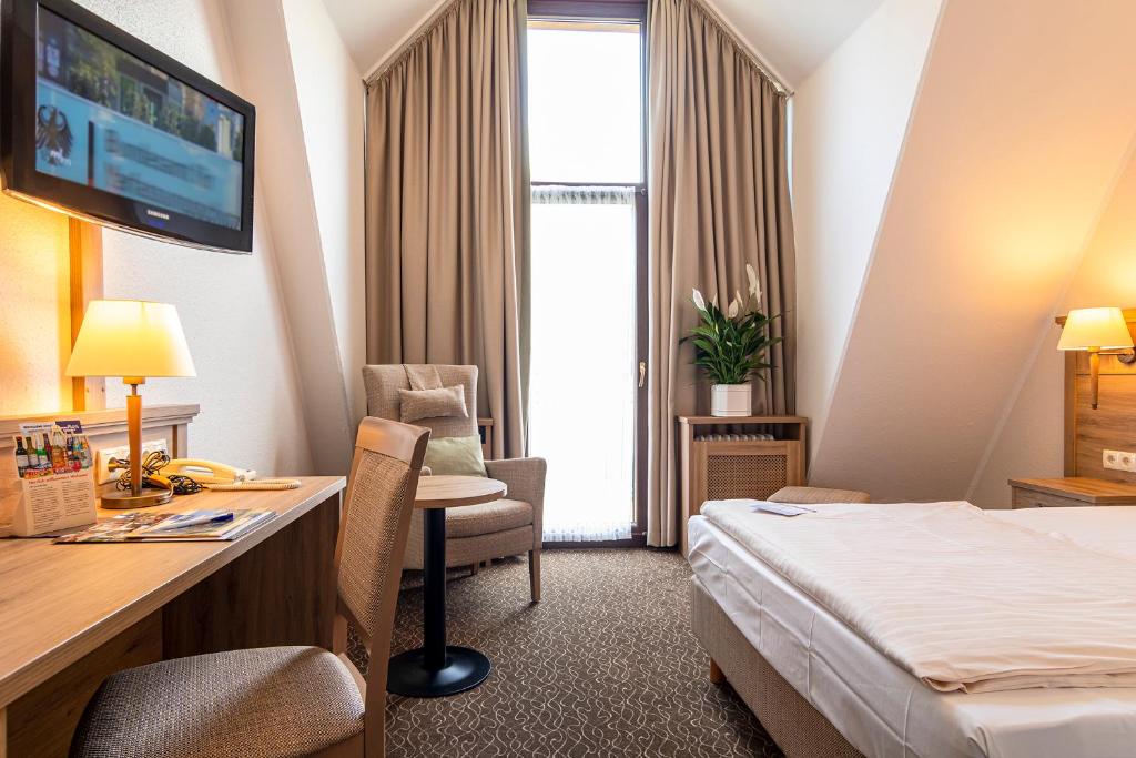 Postel nebo postele na pokoji v ubytování AMBER HOTEL Bavaria