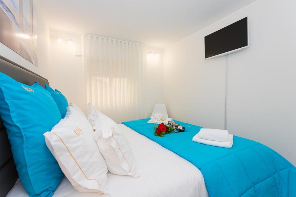 Uma cama ou camas num quarto em BestVillas Foz do Minho