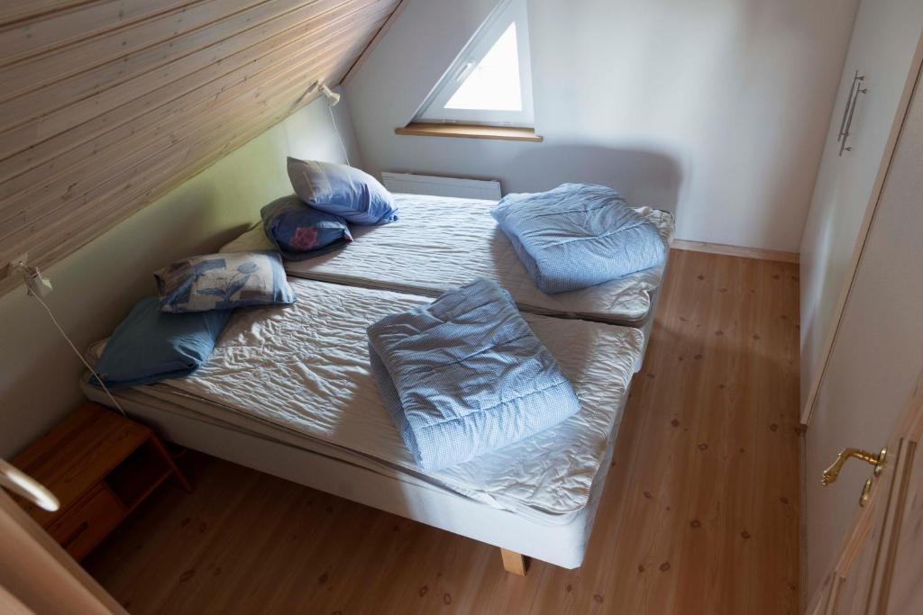 Postel nebo postele na pokoji v ubytování Magasinet
