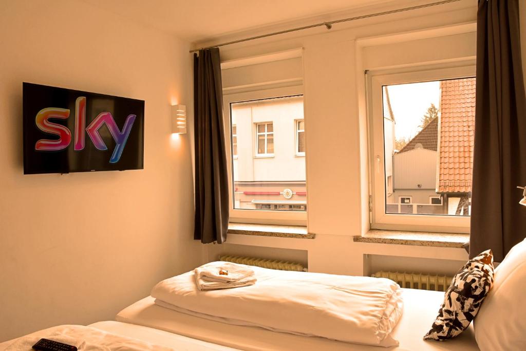 Postel nebo postele na pokoji v ubytování Hotel Walsroder Hof