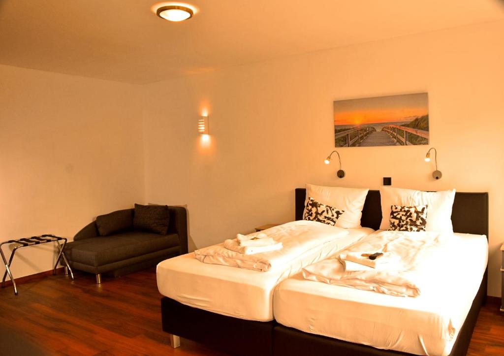 Postel nebo postele na pokoji v ubytování Hotel Walsroder Hof