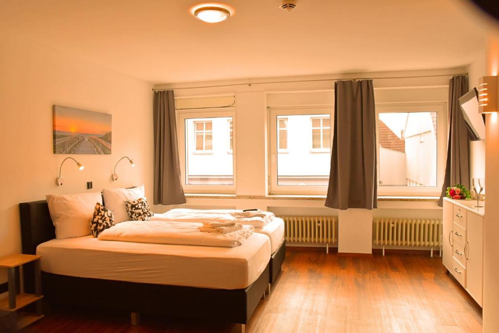 Postel nebo postele na pokoji v ubytování Hotel Walsroder Hof