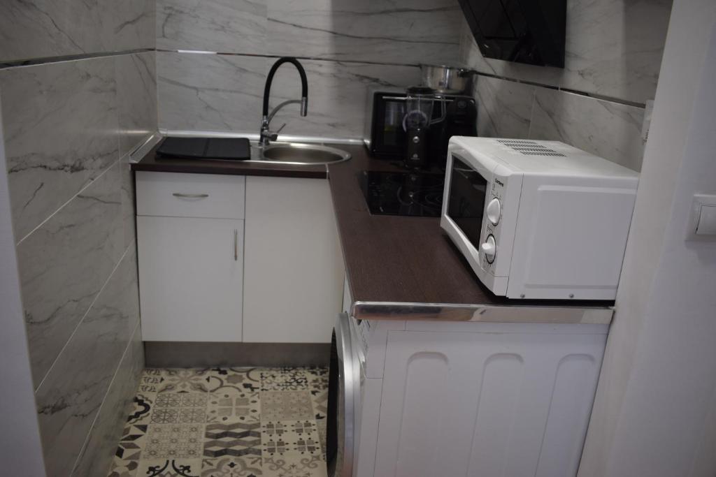 Kuchyňa alebo kuchynka v ubytovaní Los Tilos Apartments