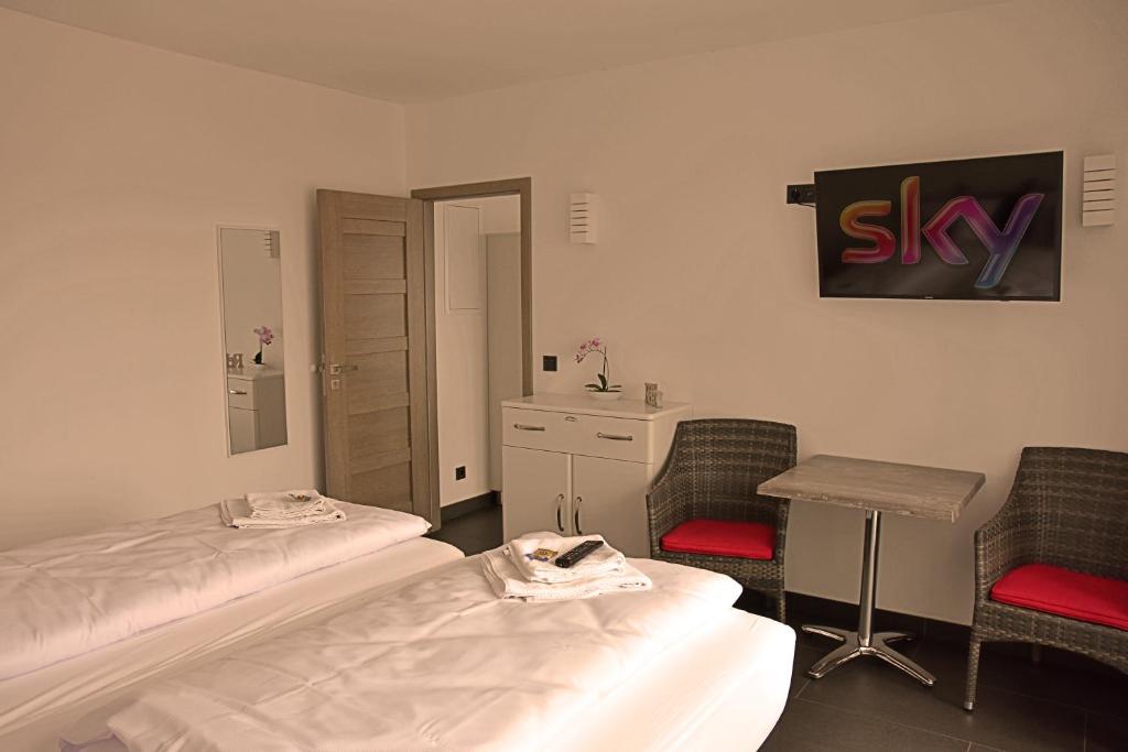 Postel nebo postele na pokoji v ubytování Hotel Walsroder Hof
