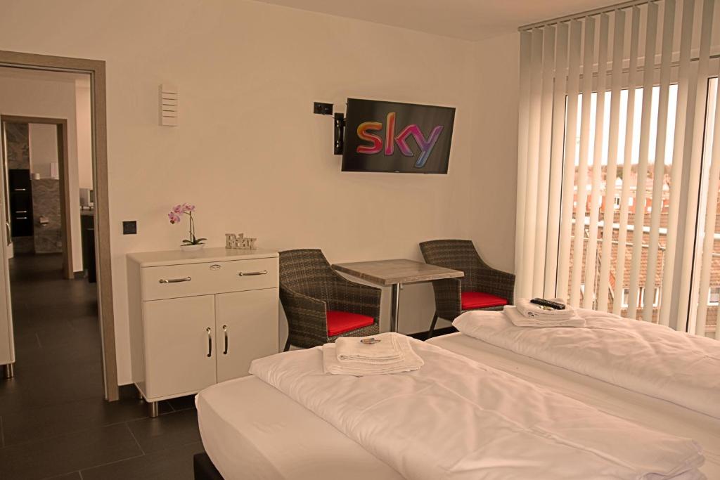 Postel nebo postele na pokoji v ubytování Hotel Walsroder Hof