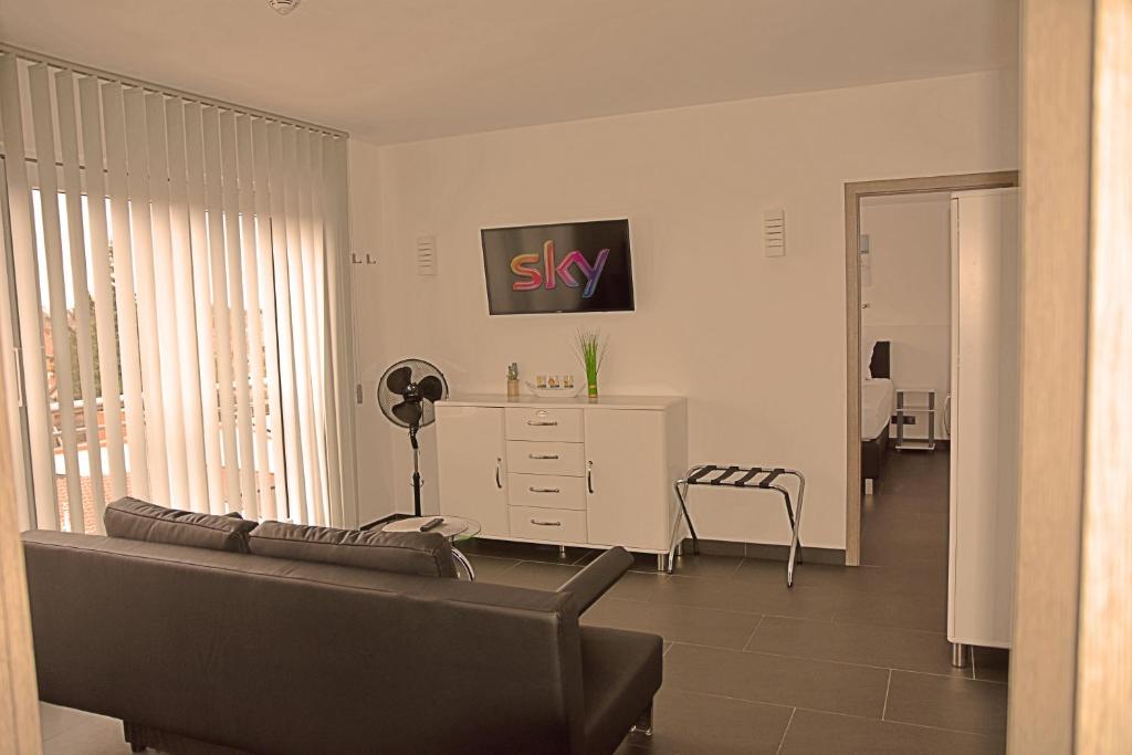TV a/nebo společenská místnost v ubytování Hotel Walsroder Hof