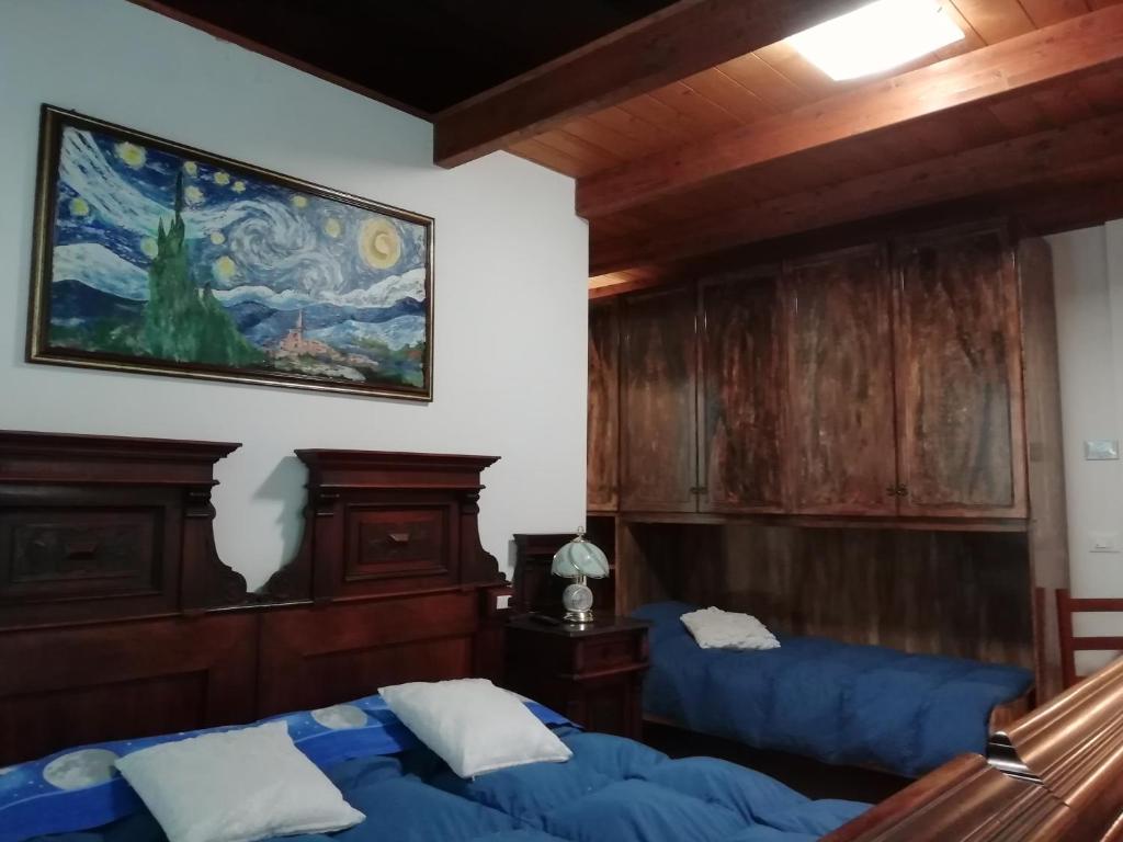 Postel nebo postele na pokoji v ubytování Le mille e una notte