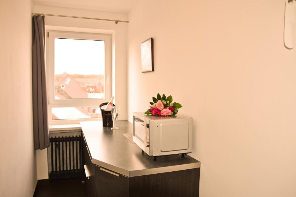 Kuchyň nebo kuchyňský kout v ubytování Hotel Walsroder Hof