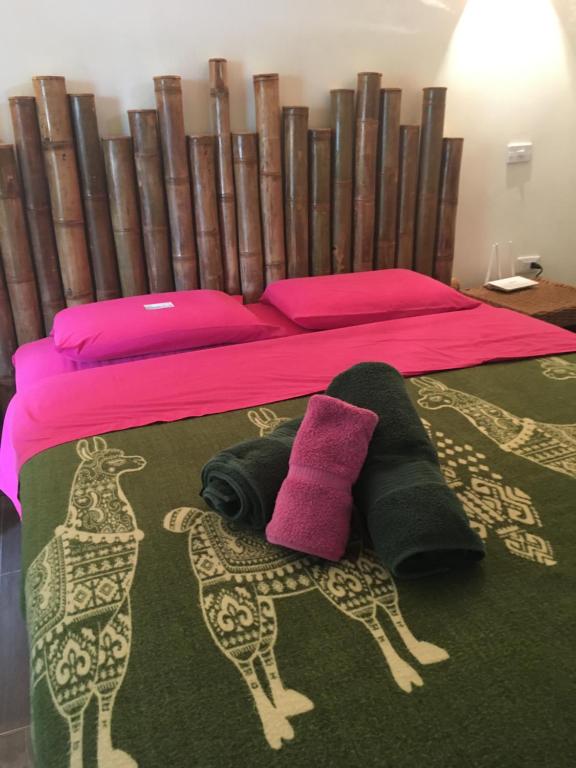Postel nebo postele na pokoji v ubytování CASITA MADAME
