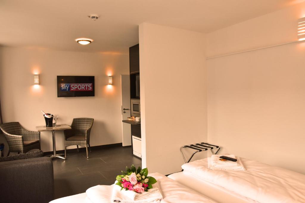 TV a/nebo společenská místnost v ubytování Hotel Walsroder Hof