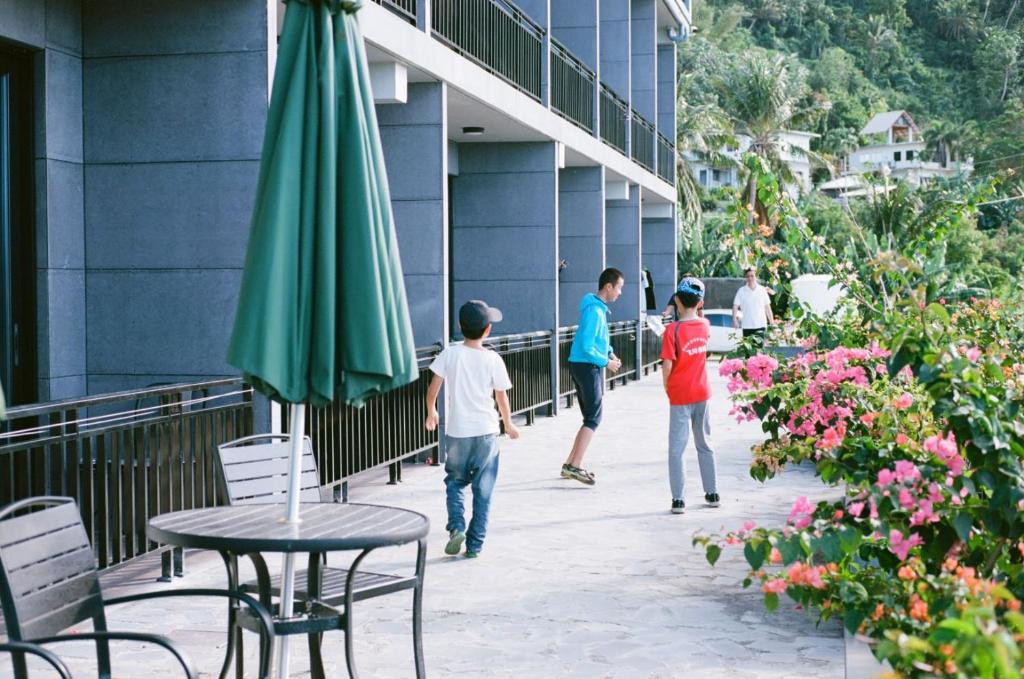 a group of people standing outside of a building at Saipan Skyline Designers Hotel in Saipan