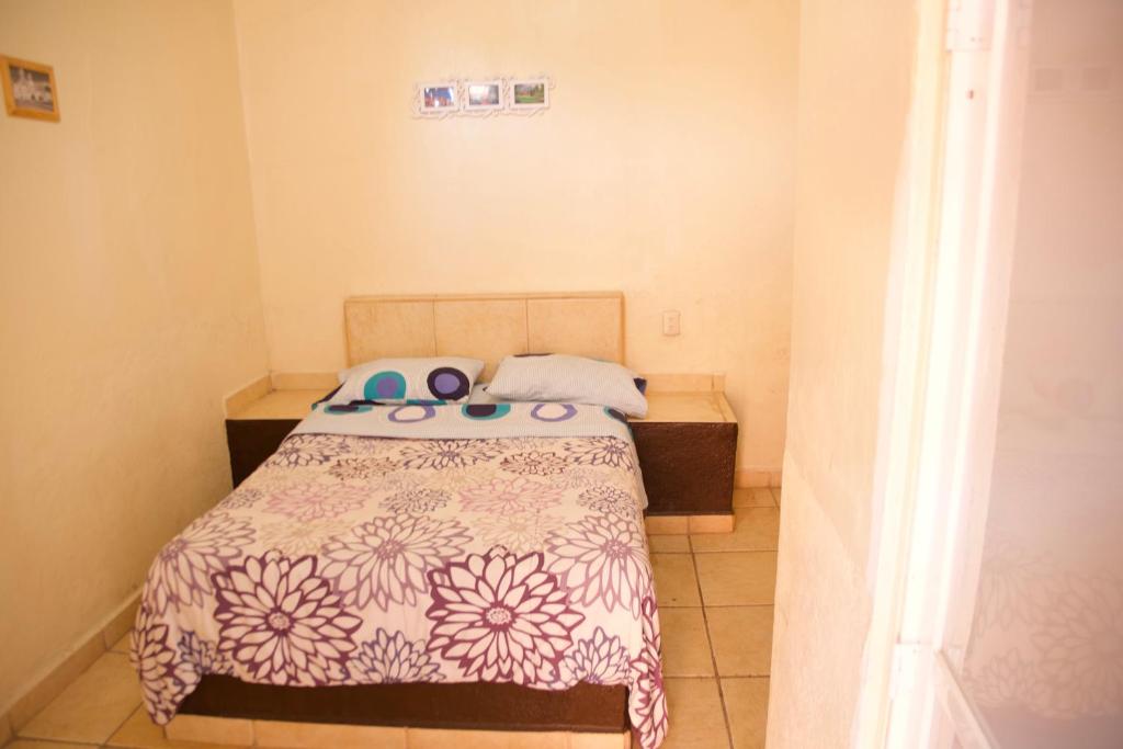 Postel nebo postele na pokoji v ubytování Hotel Cuauhtemoc