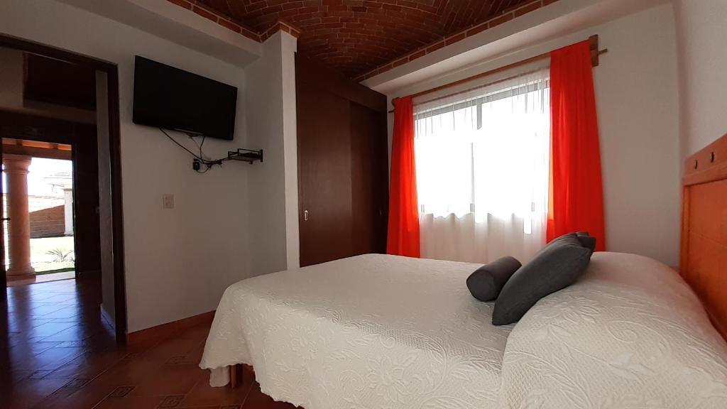 Postel nebo postele na pokoji v ubytování Villas Amalur