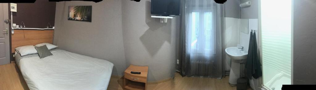 Postel nebo postele na pokoji v ubytování L'Audycé