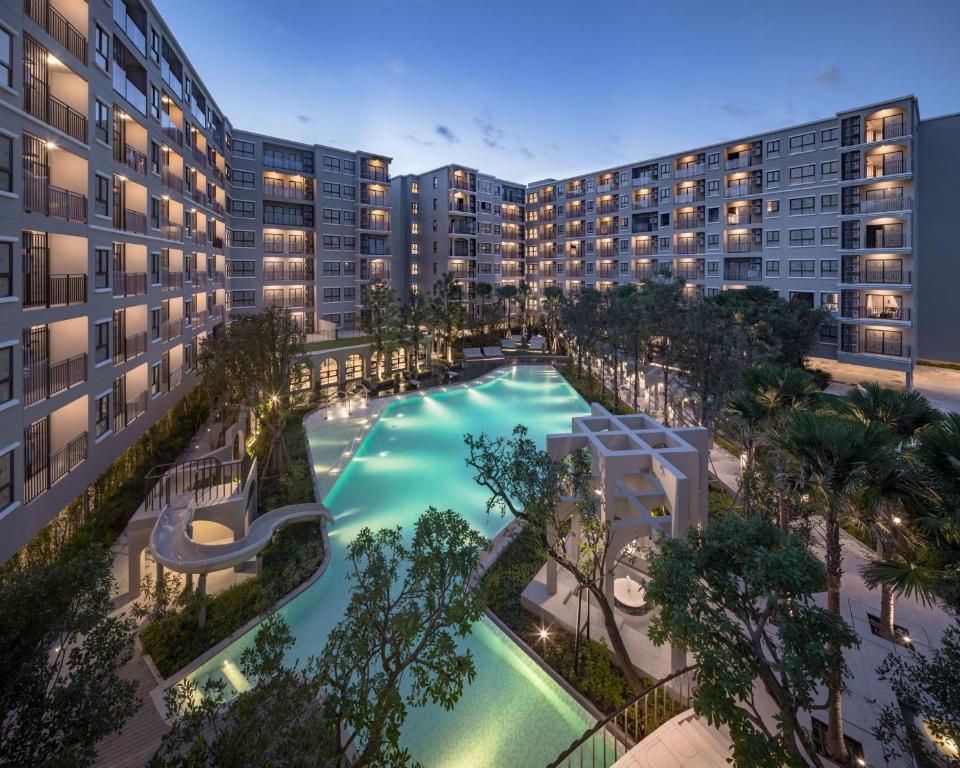 an overhead view of a swimming pool in an apartment complex at La Casita pool access condo HuaHin in Hua Hin