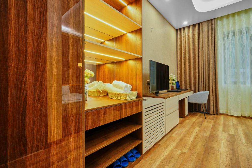 TV a/nebo společenská místnost v ubytování BBQ Hostel Ha Long 2