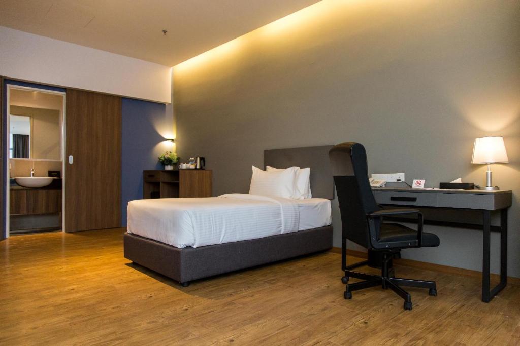 Postel nebo postele na pokoji v ubytování Imperial Regency Suites & Kuala Lumpur