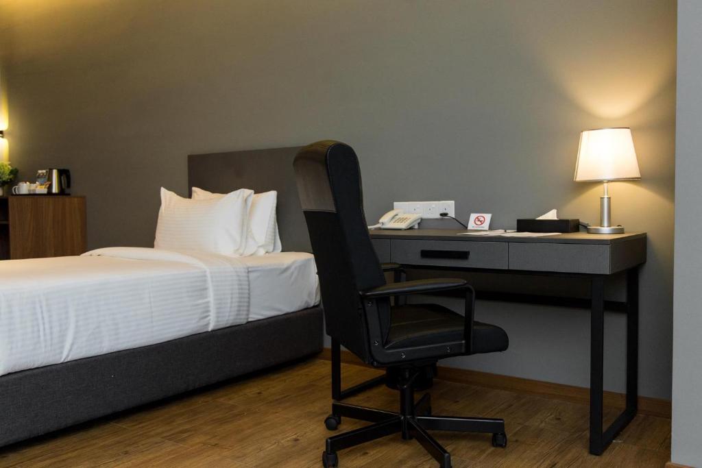 Postel nebo postele na pokoji v ubytování Imperial Regency Suites & Kuala Lumpur