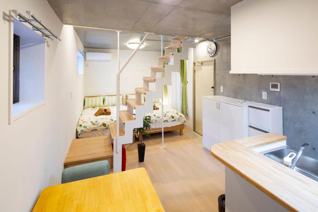 Kuchyň nebo kuchyňský kout v ubytování Laffitte Hirai Condominium Hotel