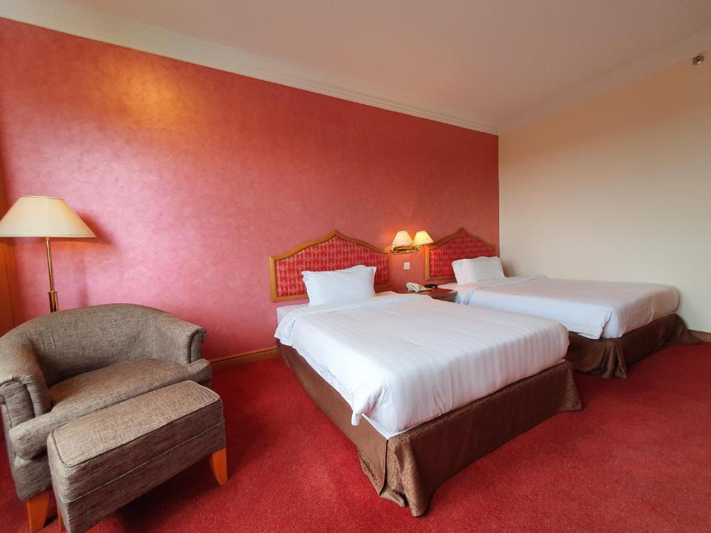 Кровать или кровати в номере Parkview Hotel